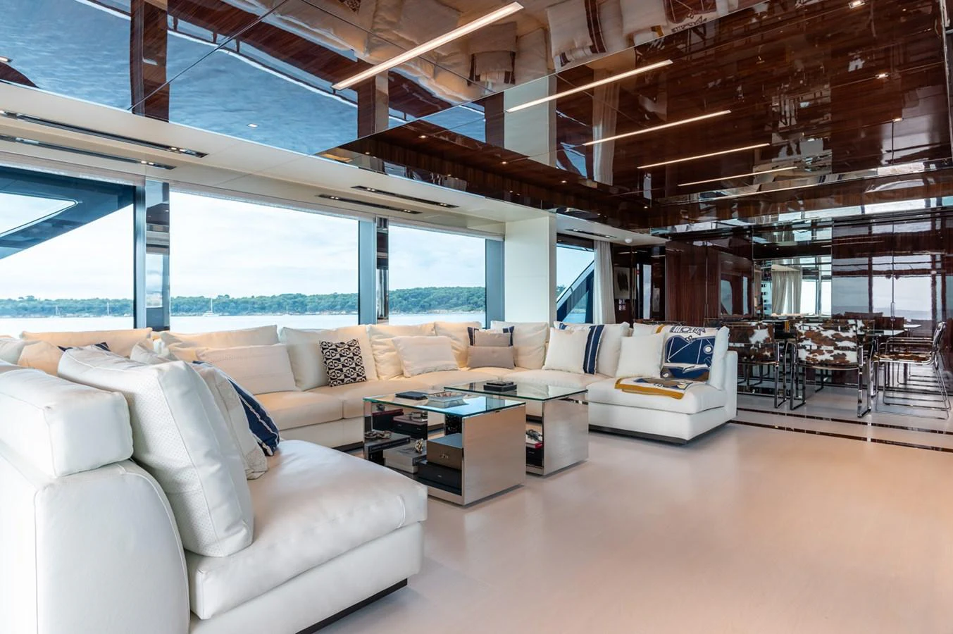 a living room with a large window aboard RIVA DOLCEVITA 110 Yacht for Sale