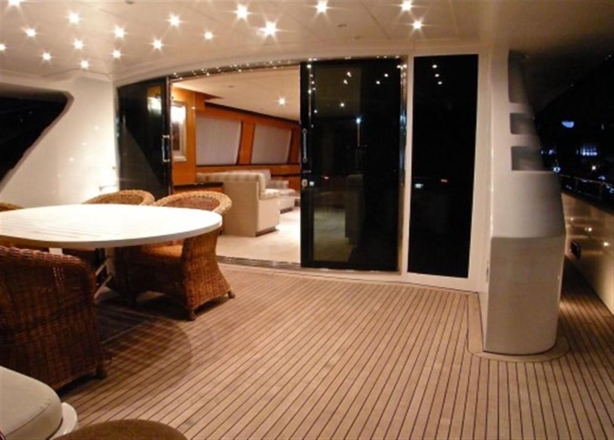 a room with a table and chairs aboard TECNOMAR 34 NADARA Yacht for Sale
