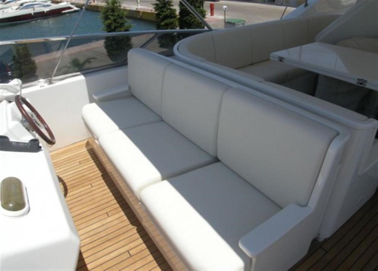 a white couch on a deck aboard TECNOMAR 34 NADARA Yacht for Sale