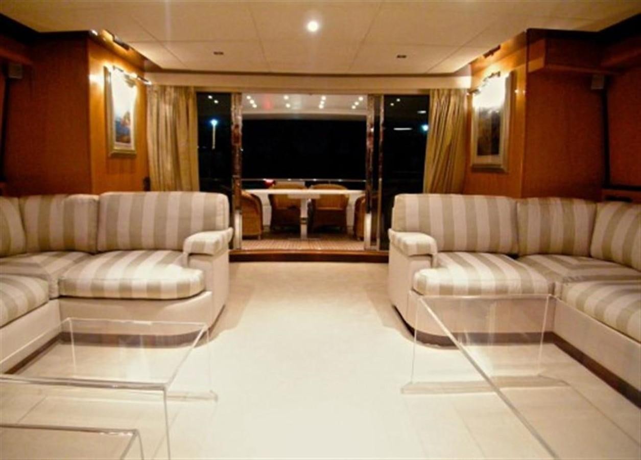 a living room with a large screen aboard TECNOMAR 34 NADARA Yacht for Sale
