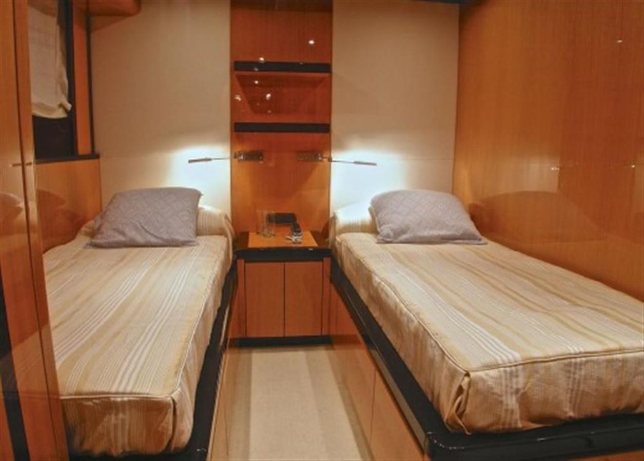 a couple of beds in a hotel room aboard TECNOMAR 34 NADARA Yacht for Sale