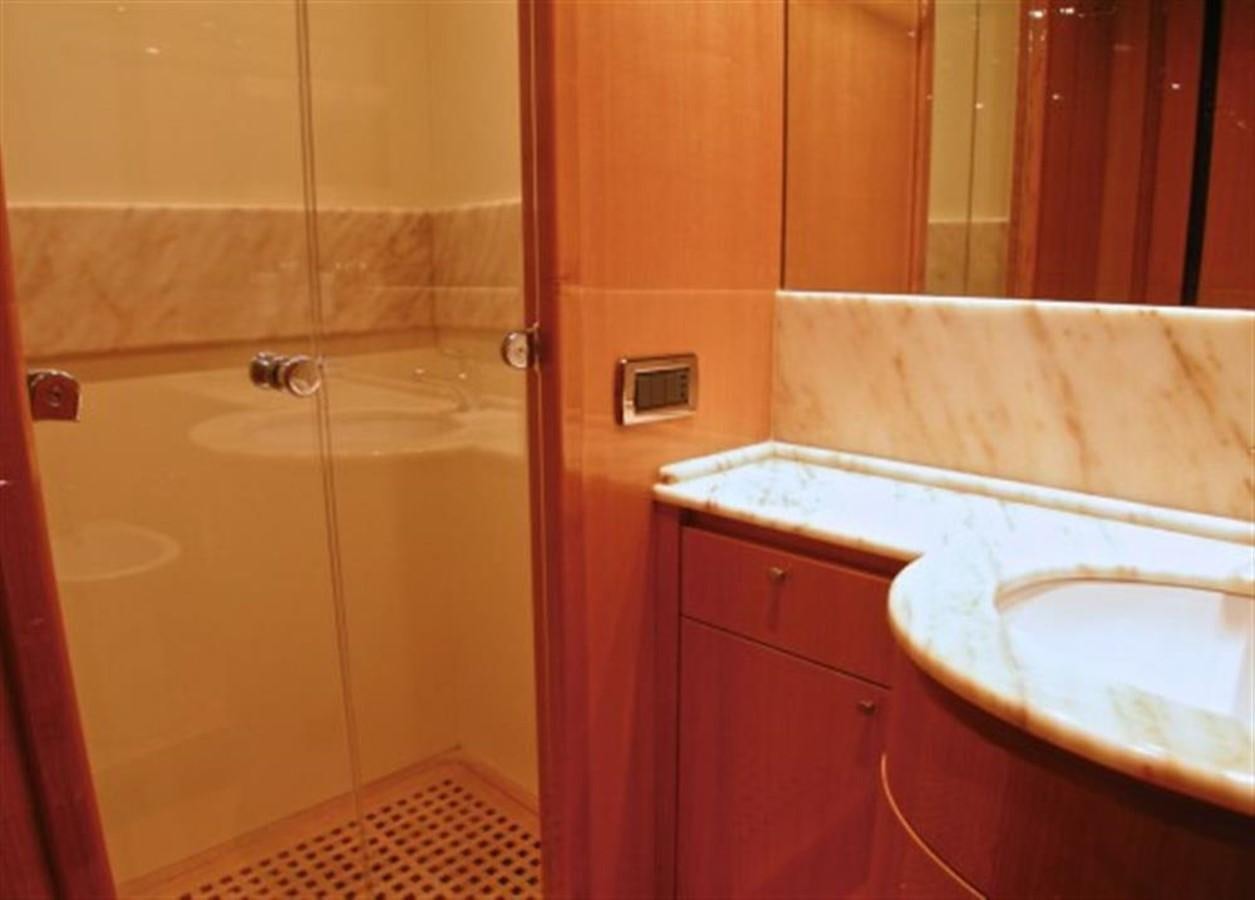 a bathroom with a bathtub and sink aboard TECNOMAR 34 NADARA Yacht for Sale
