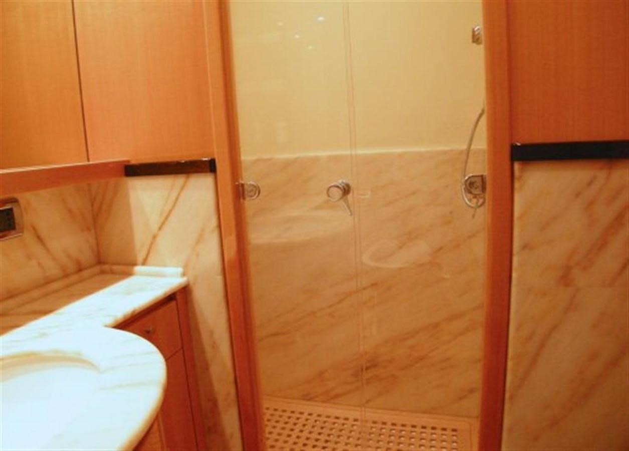 a bathroom with a shower and a sink aboard TECNOMAR 34 NADARA Yacht for Sale