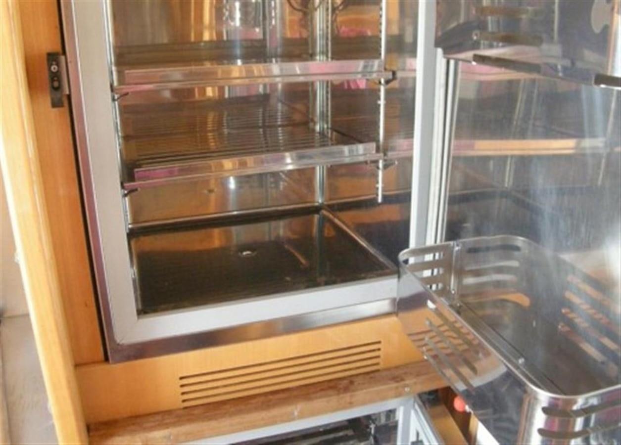 a glass case with a glass door aboard TECNOMAR 34 NADARA Yacht for Sale