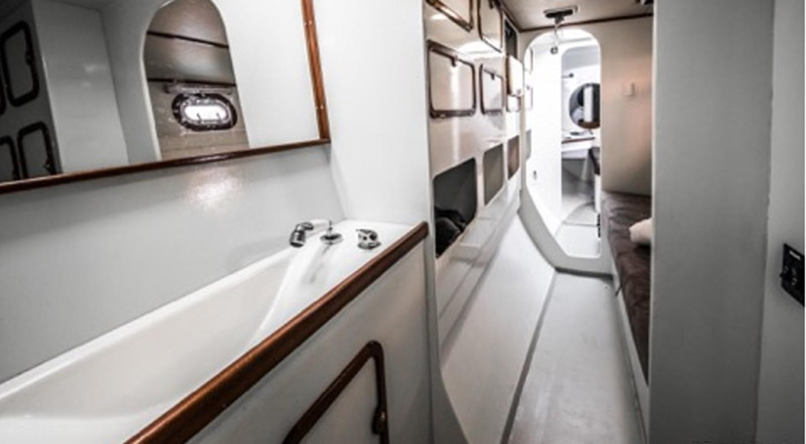 a bathroom with a large mirror aboard OCEAN PEARL Yacht for Sale