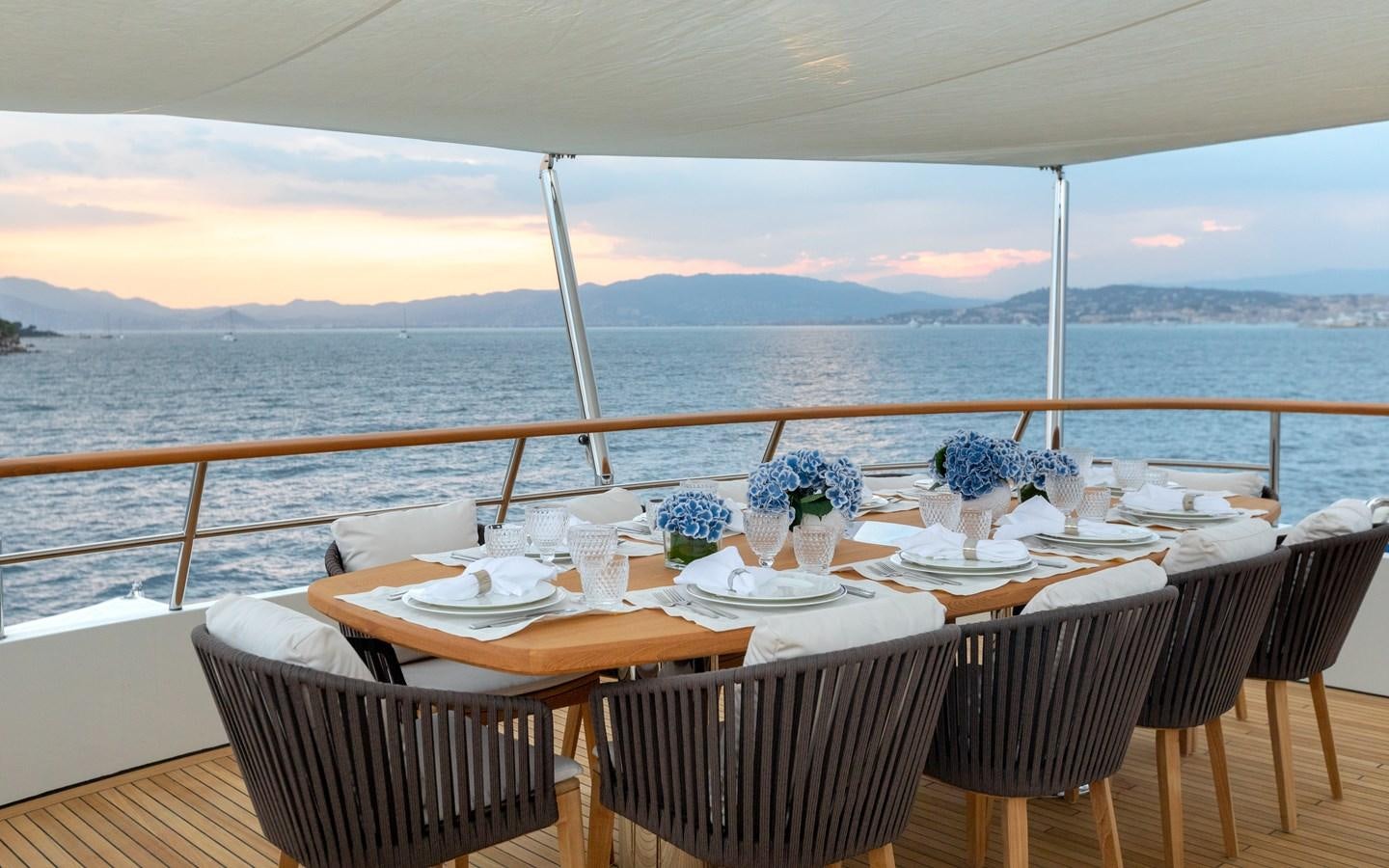 a table set for a dinner on a boat aboard ROBBIE BOBBY Yacht for Charter