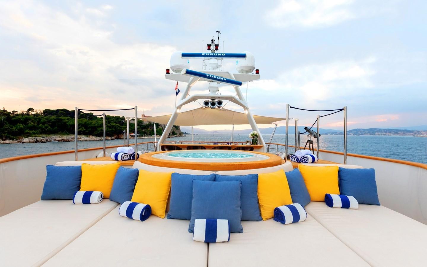 a lounge area with a large white ship on it aboard ROBBIE BOBBY Yacht for Charter