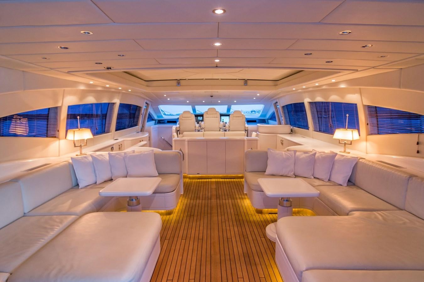 a room with a couch and a table aboard LE MAGNIFIQUE Yacht for Sale