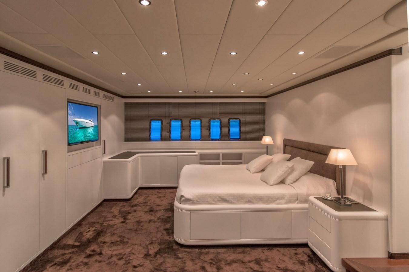 a bedroom with a large bed aboard LE MAGNIFIQUE Yacht for Sale