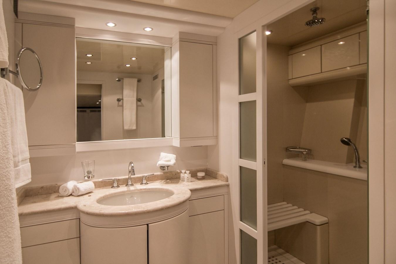 a bathroom with a large mirror aboard LE MAGNIFIQUE Yacht for Sale