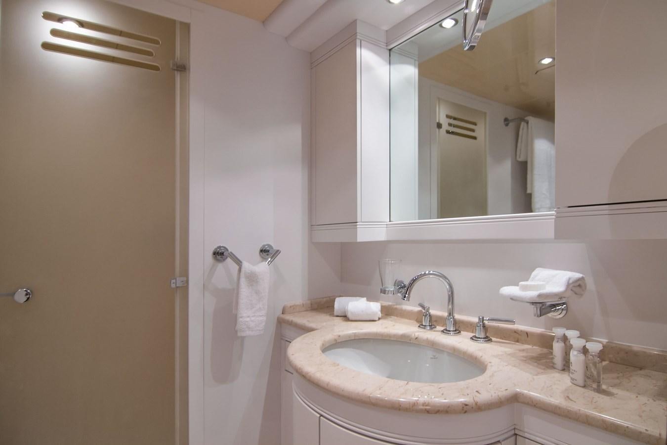 a bathroom with a sink and a mirror aboard LE MAGNIFIQUE Yacht for Sale