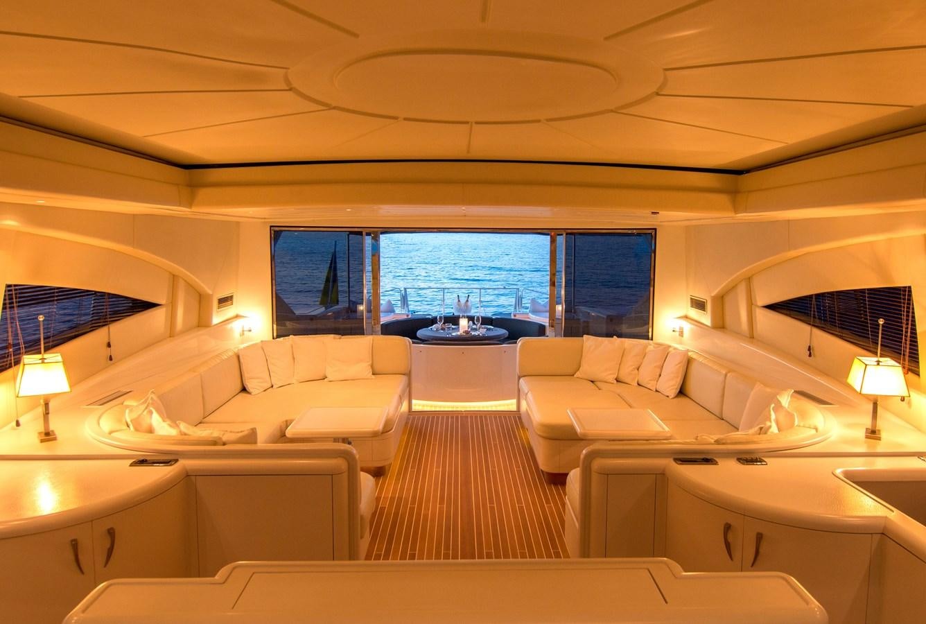 a living room with a large window aboard LE MAGNIFIQUE Yacht for Sale