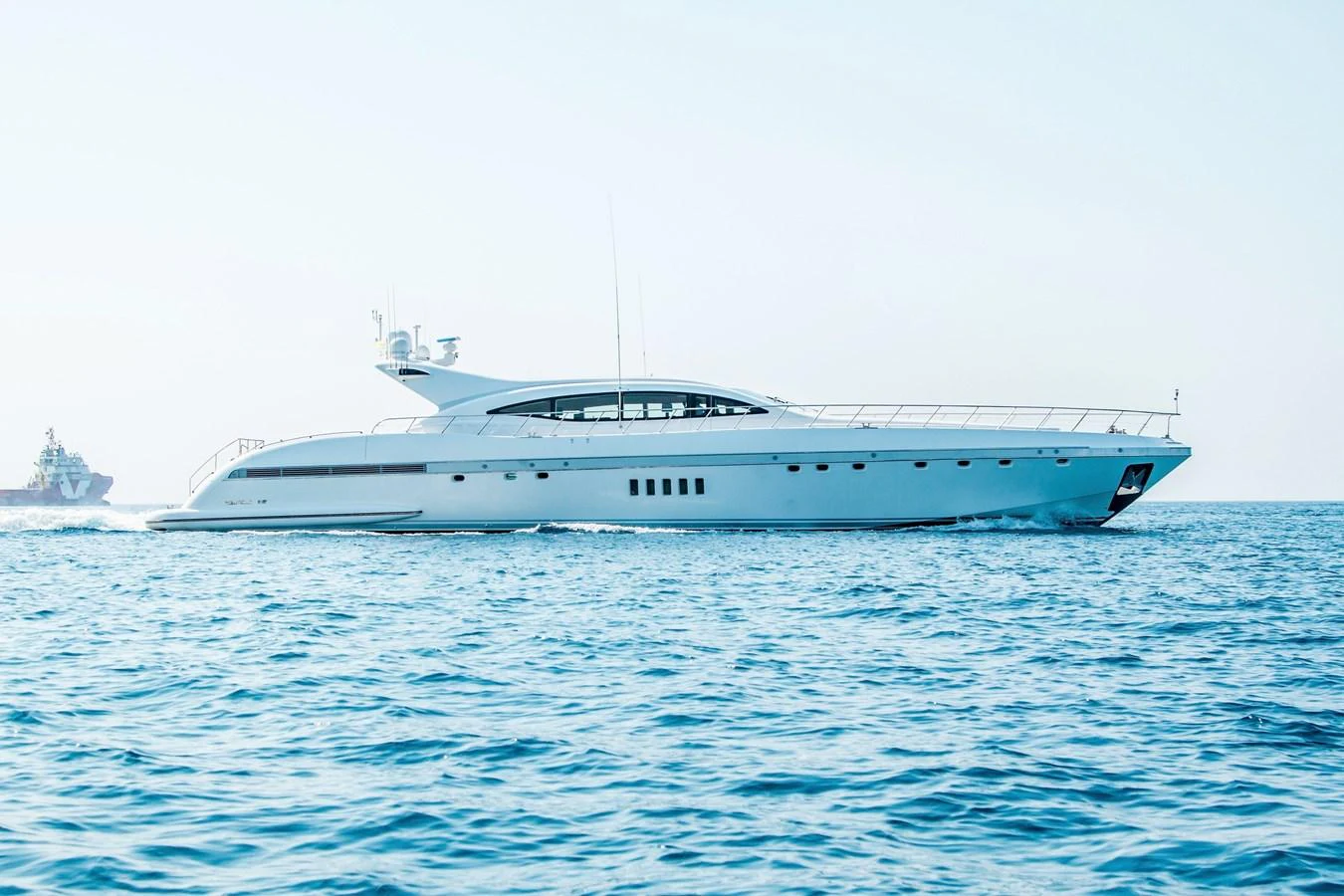 a white yacht in the water aboard YALLA Yacht for Sale