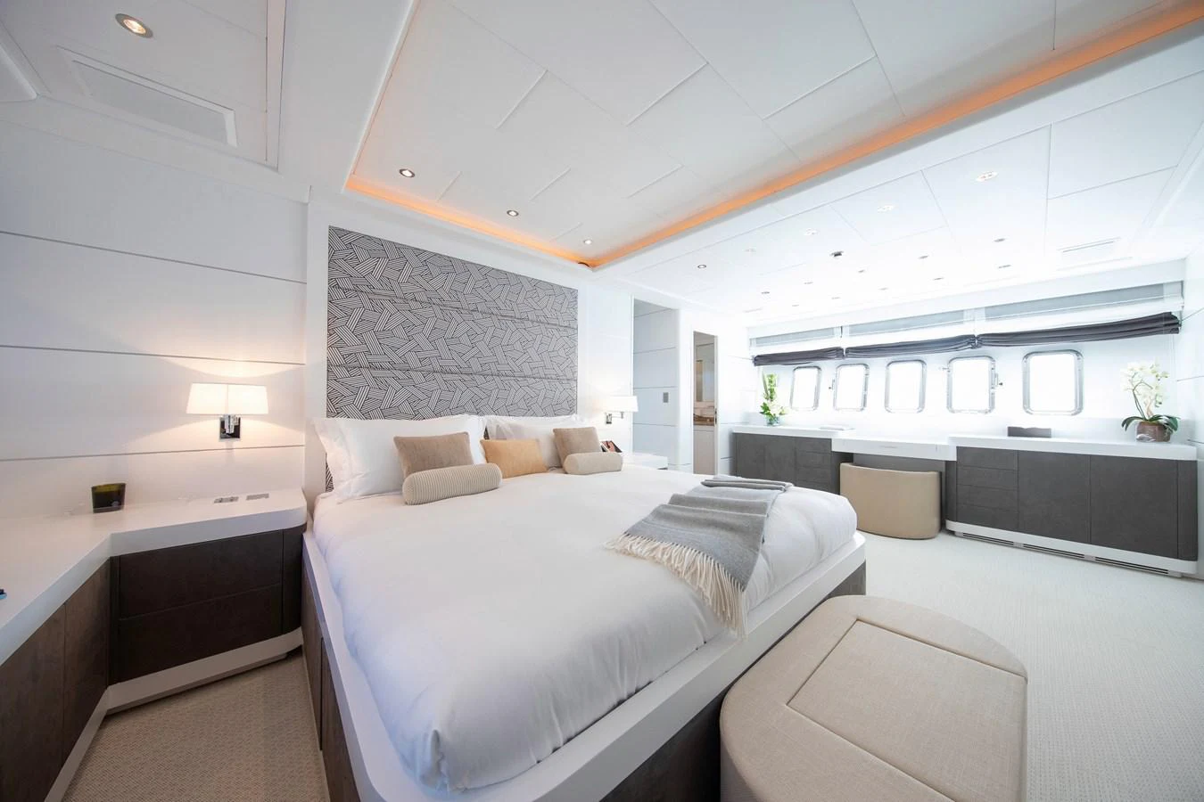 a room with a bed and a window aboard YALLA Yacht for Sale