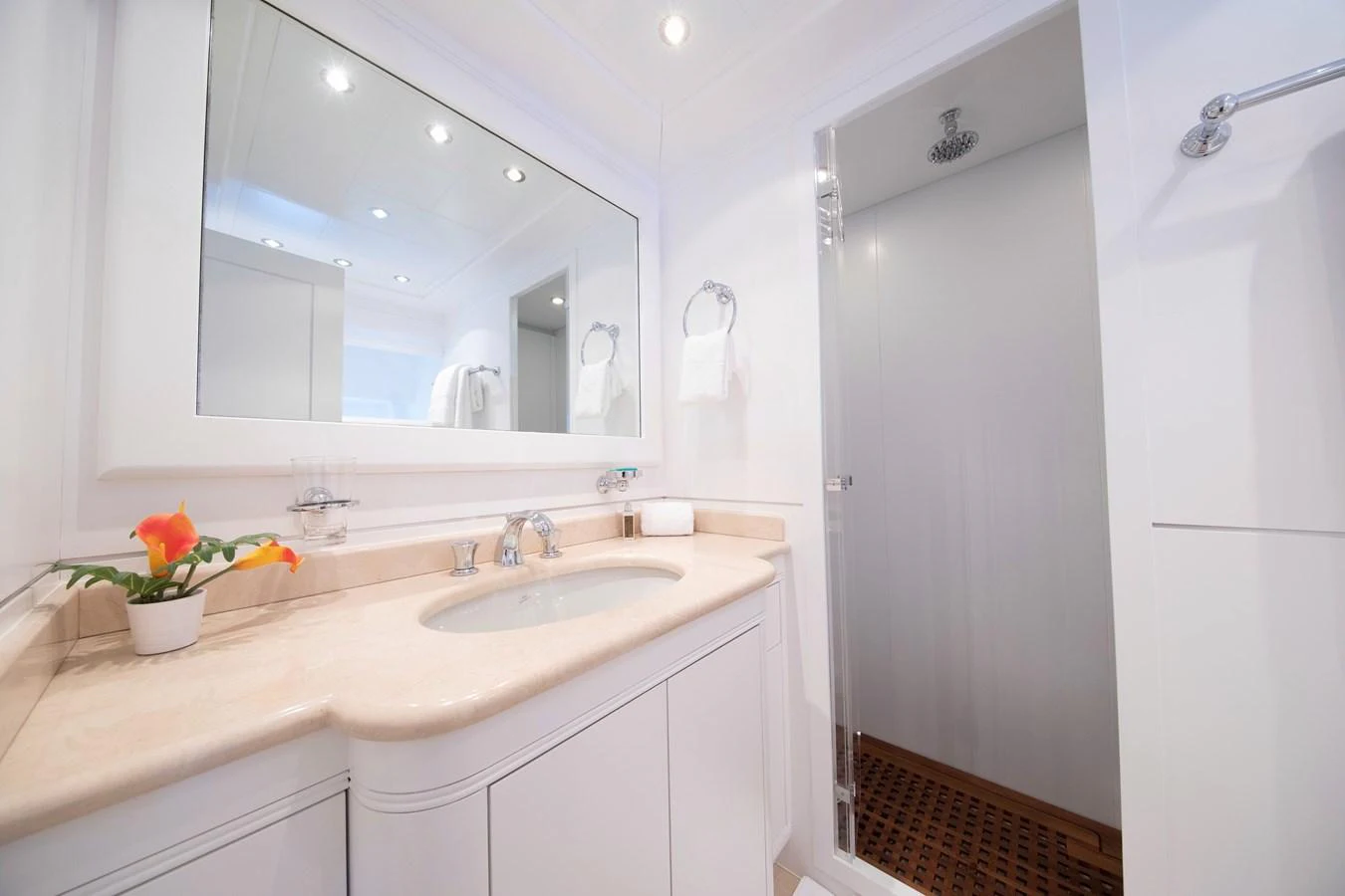 a bathroom with a large mirror aboard YALLA Yacht for Sale