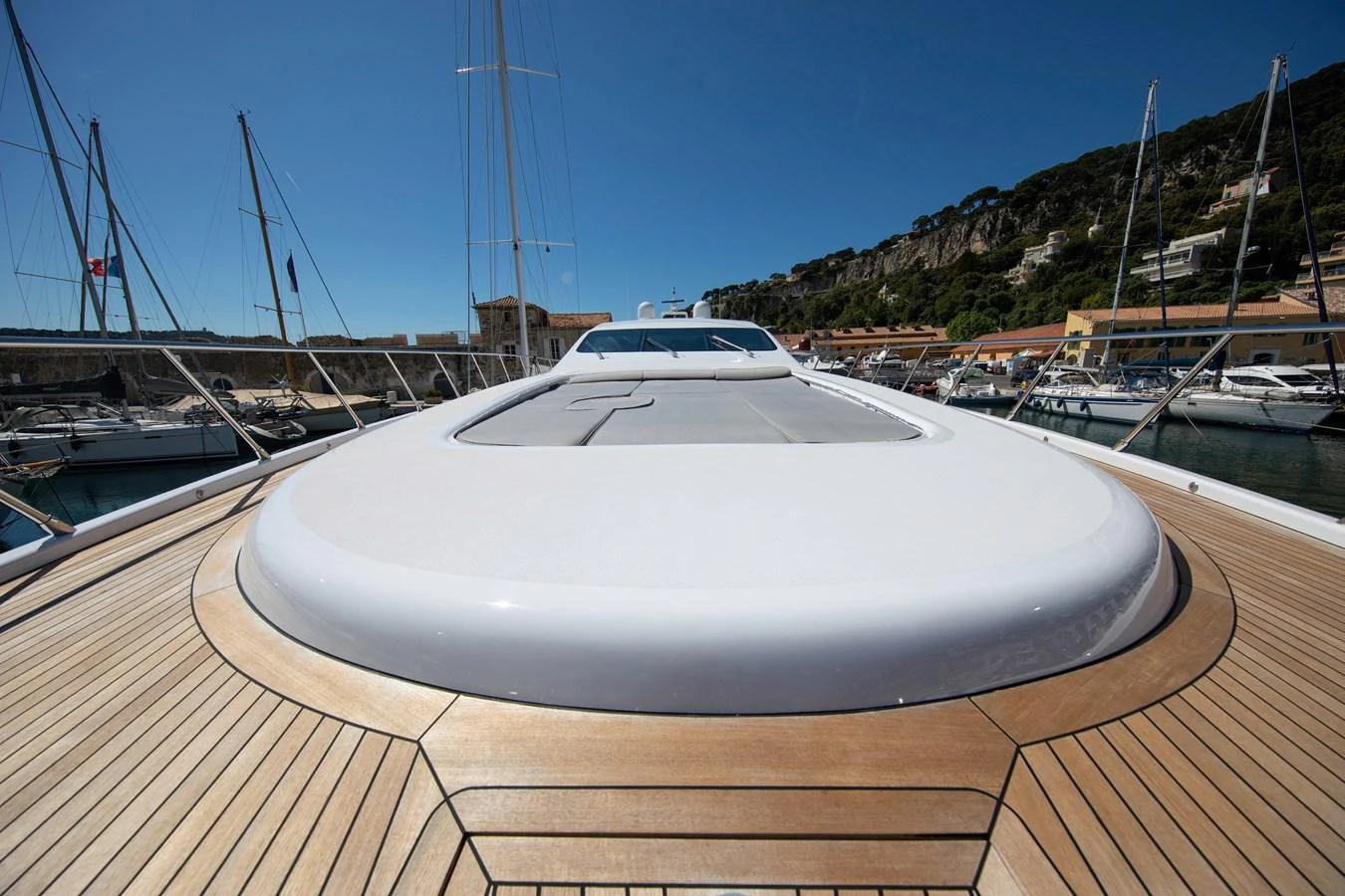 a white boat on a dock aboard YALLA Yacht for Sale