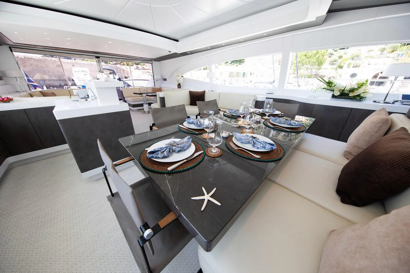a living room with a large window aboard YALLA Yacht for Sale