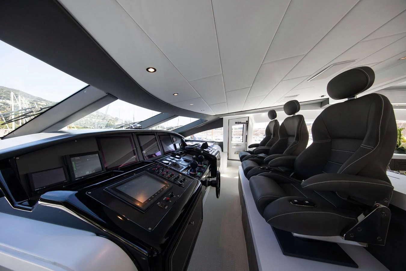 inside of a car aboard YALLA Yacht for Sale
