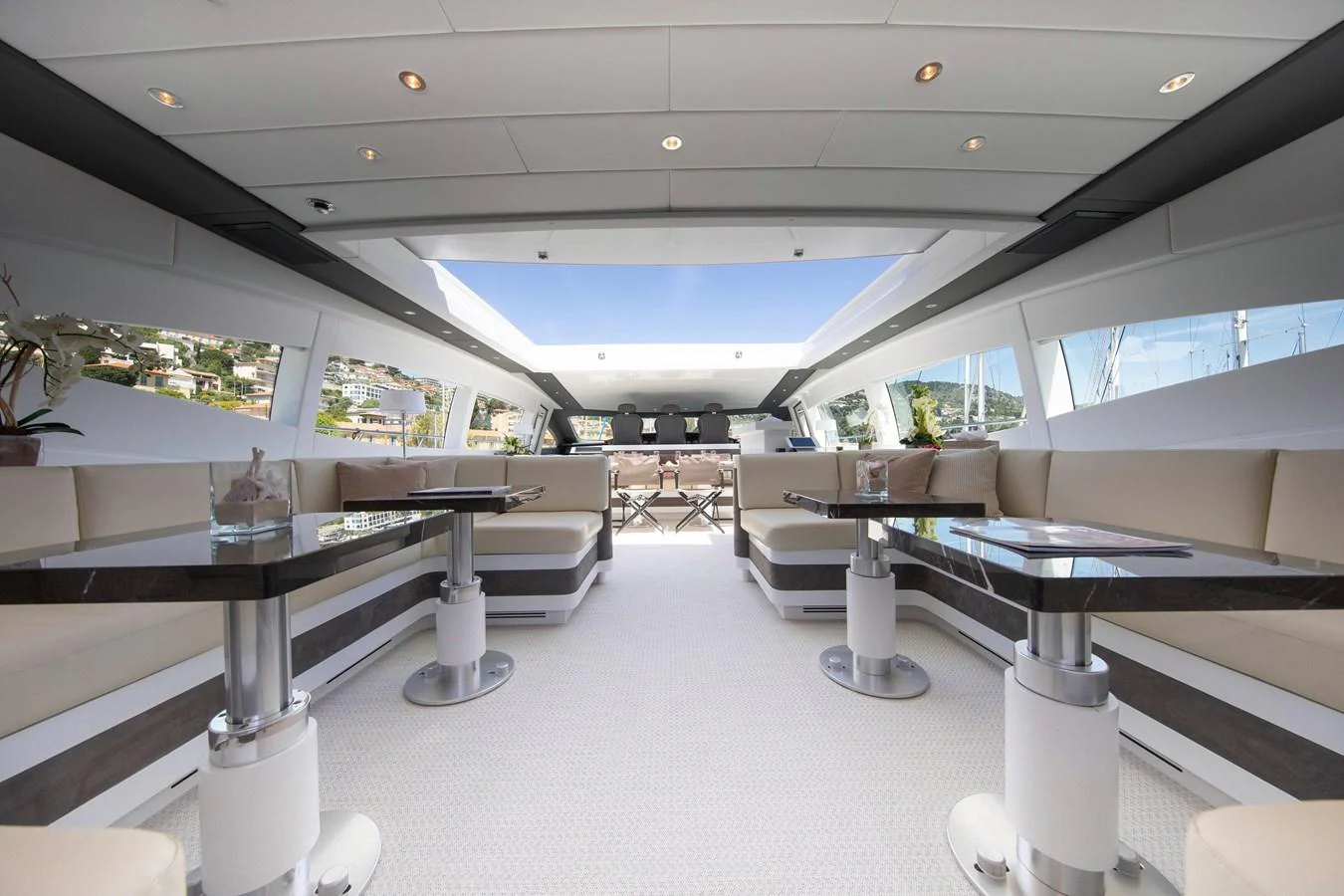 a room with a table and chairs aboard YALLA Yacht for Sale