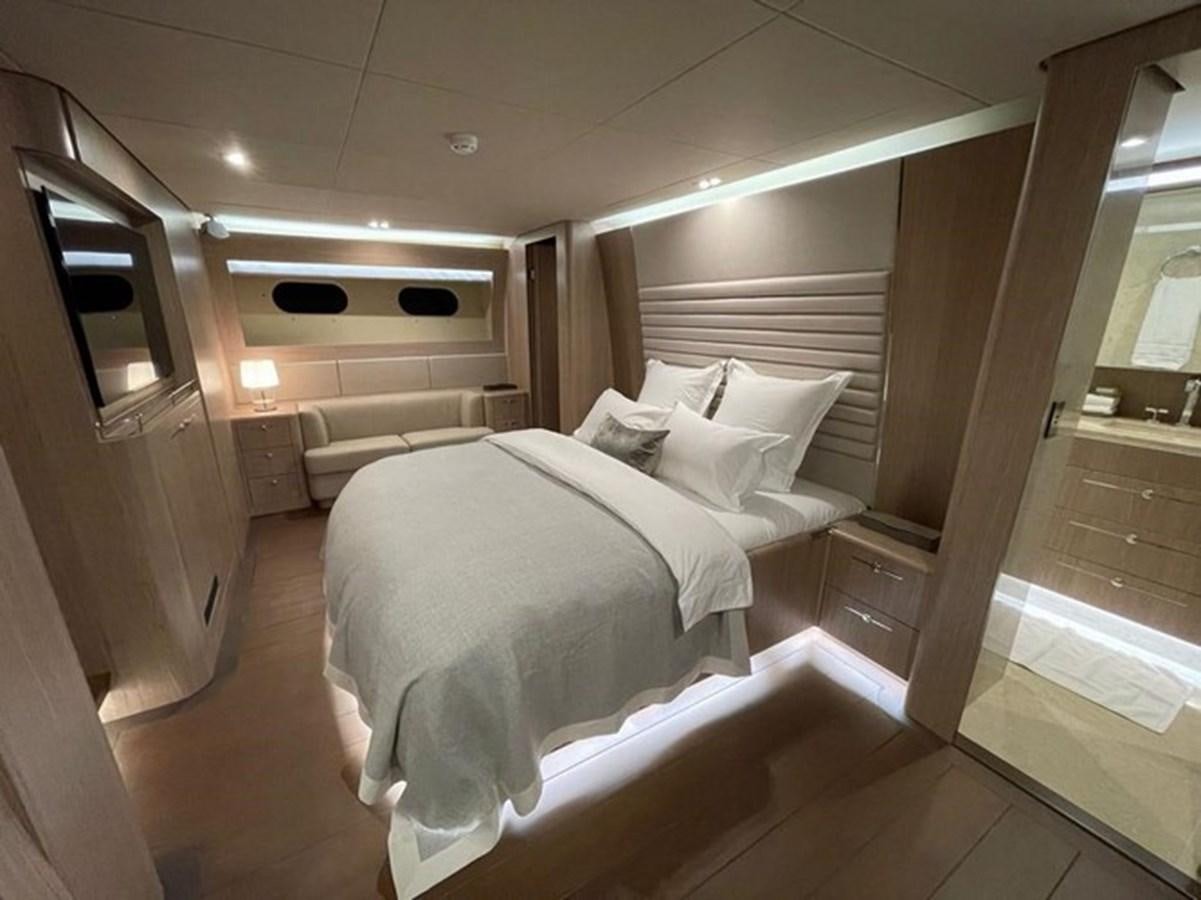 a room with a bed and a mirror aboard DREAM Yacht for Sale