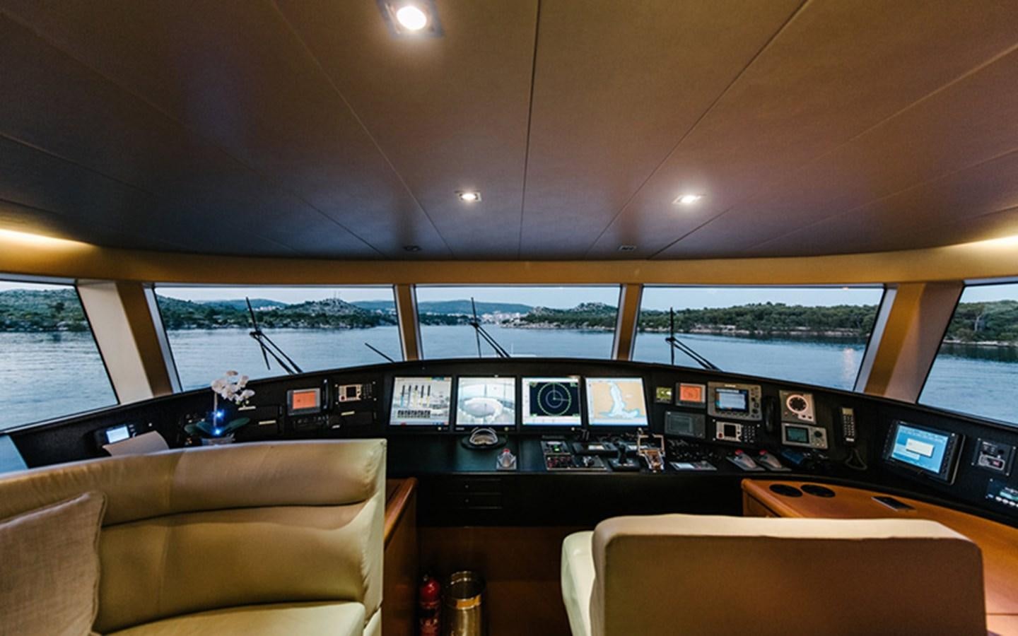 a room with a couch and a television set aboard DREAM Yacht for Sale