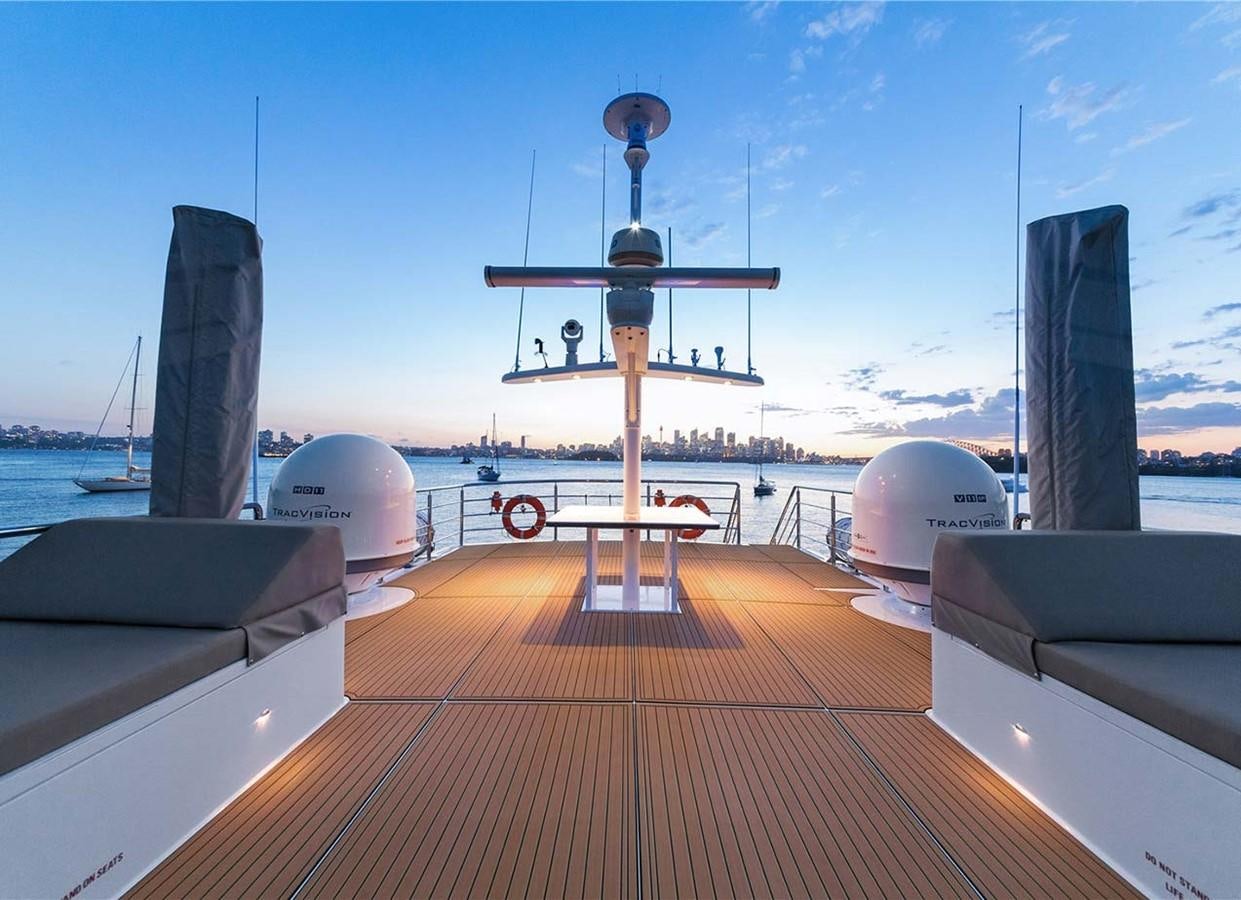 a deck with a satellite dish and satellite dish on it aboard CORROBOREE Yacht for Sale