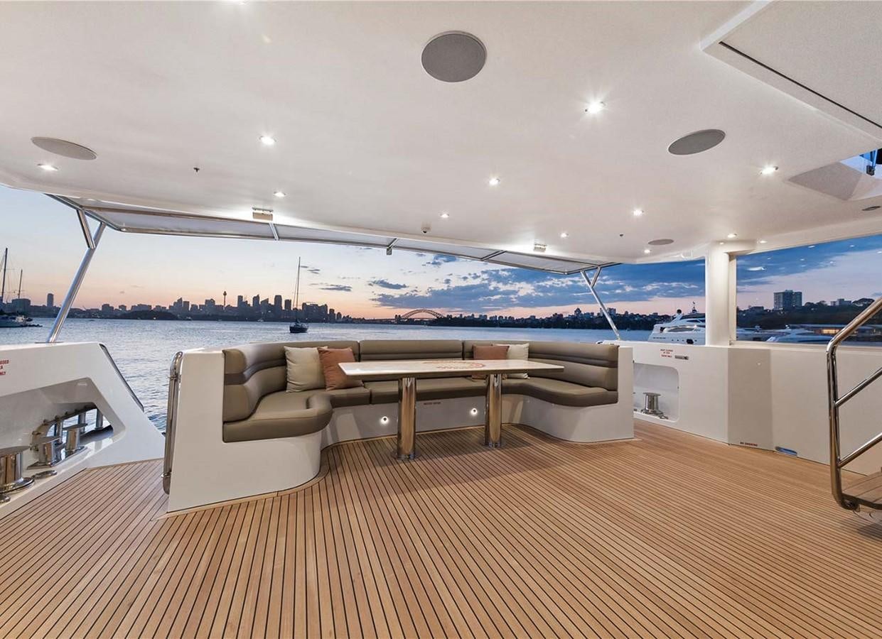a room with a table and chairs aboard CORROBOREE Yacht for Sale