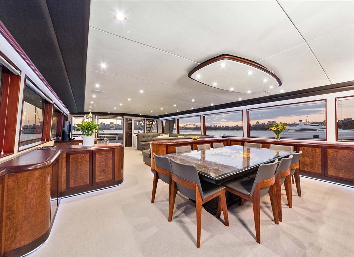 a large kitchen with a large island aboard CORROBOREE Yacht for Sale