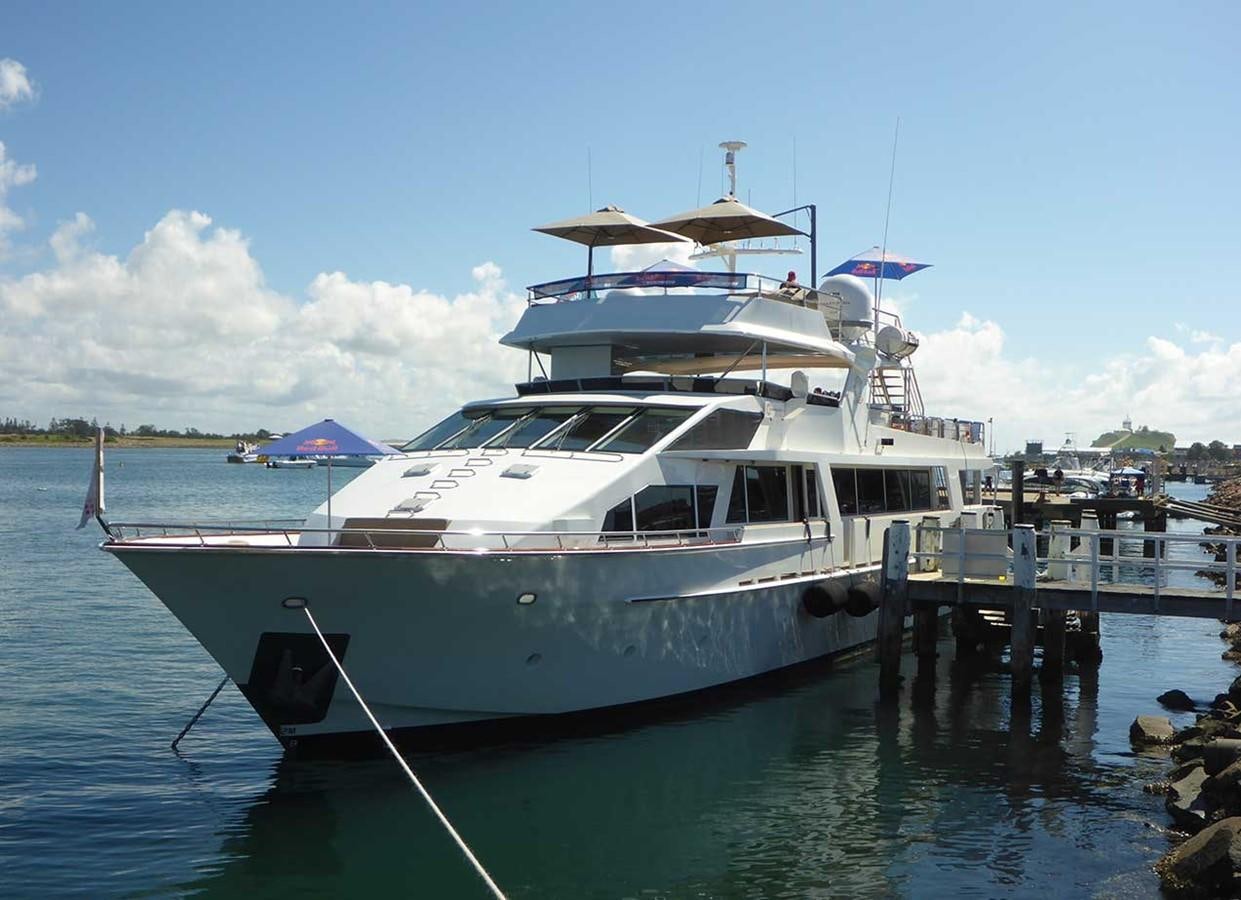 a boat docked at a pier aboard CORROBOREE Yacht for Sale