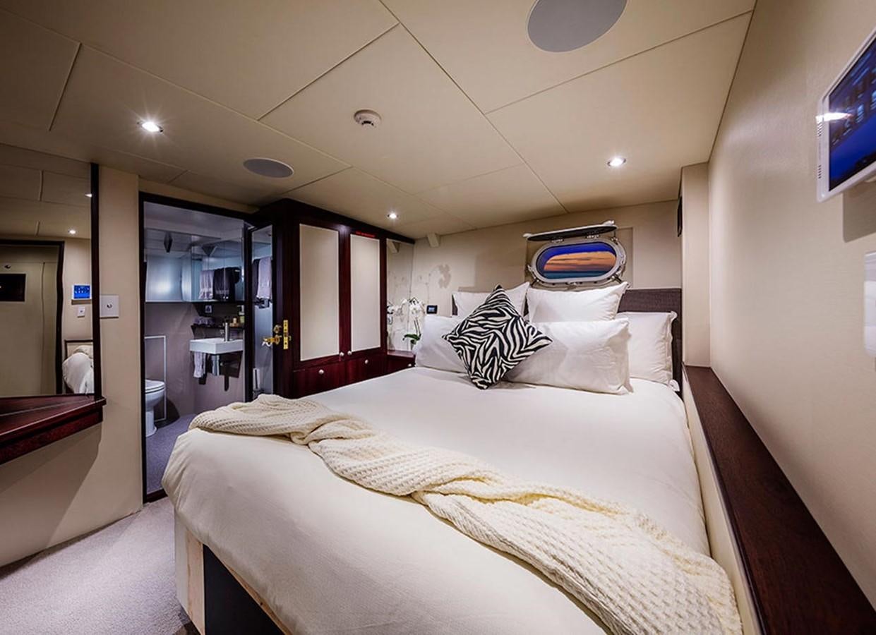 a bed in a hotel room aboard CORROBOREE Yacht for Sale