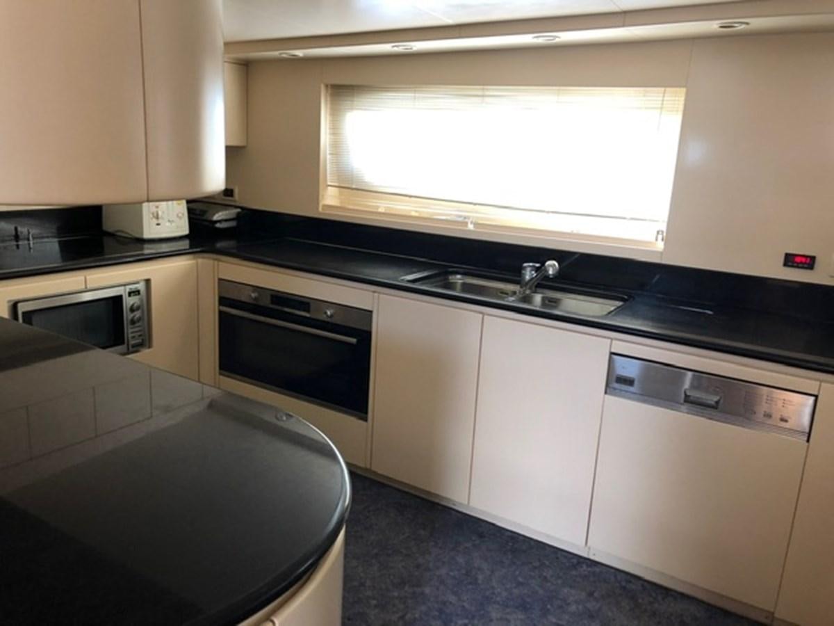 a kitchen with a large window aboard ENERGY Yacht for Sale