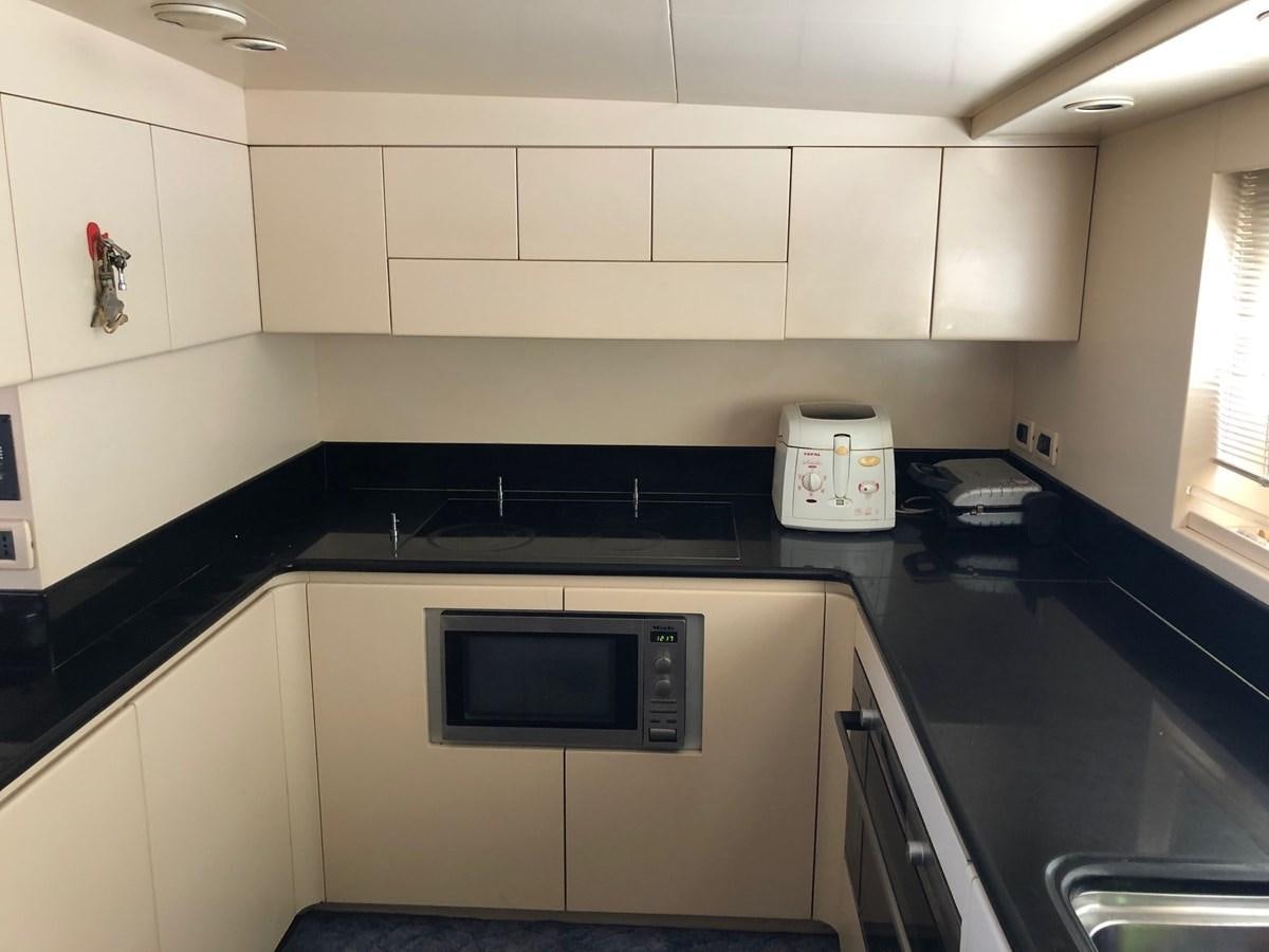 a kitchen with a microwave oven aboard ENERGY Yacht for Sale