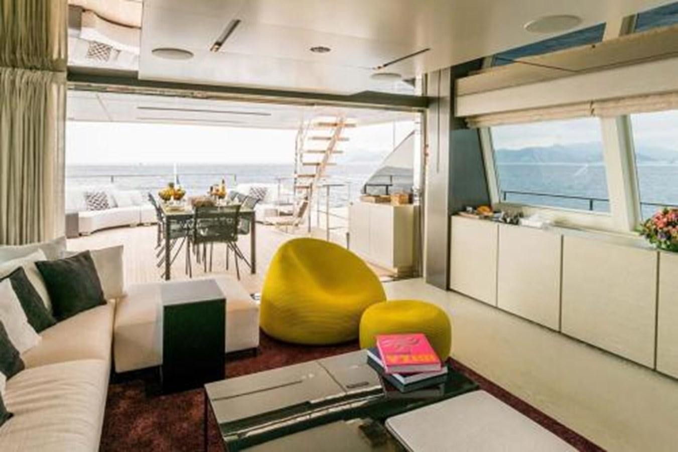 a living room with a couch and a television aboard DECEMBER SIX Yacht for Sale