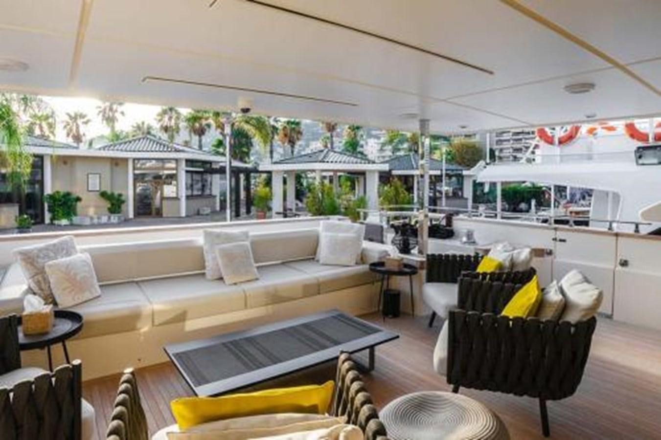 a living room with a couch and a table aboard DECEMBER SIX Yacht for Sale