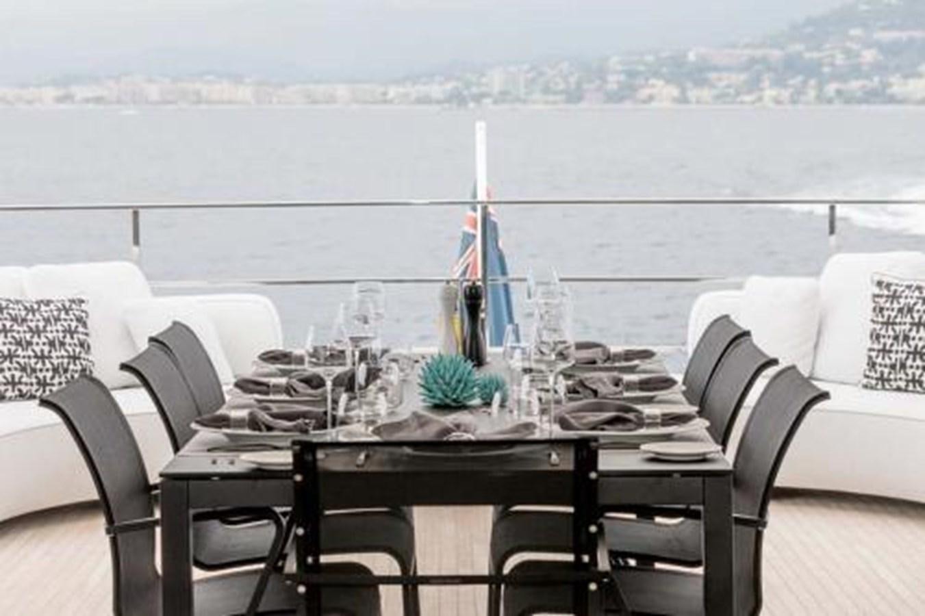 a table with a glass vase on it aboard DECEMBER SIX Yacht for Sale