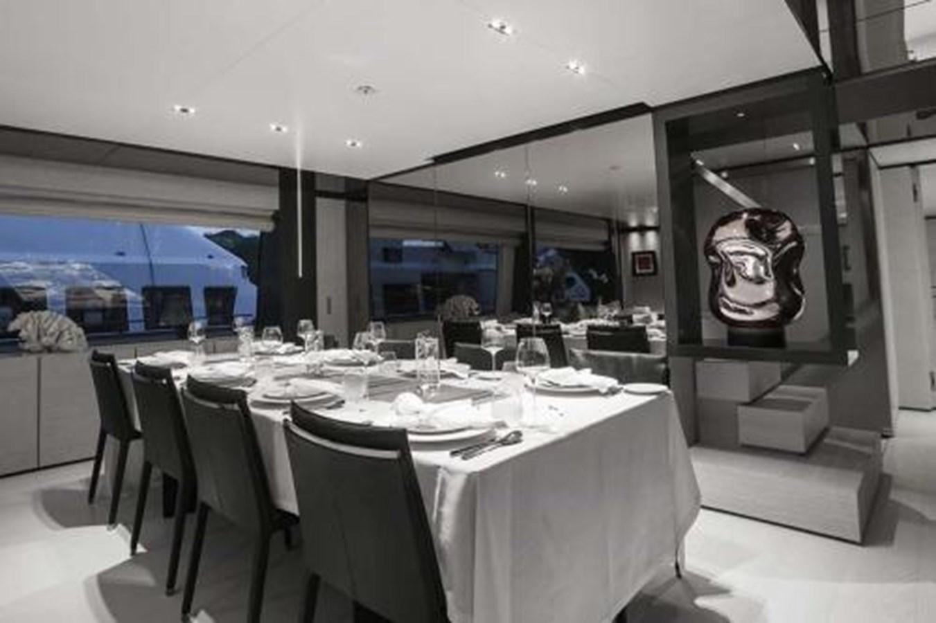 a large dining room with a large table and chairs aboard DECEMBER SIX Yacht for Sale