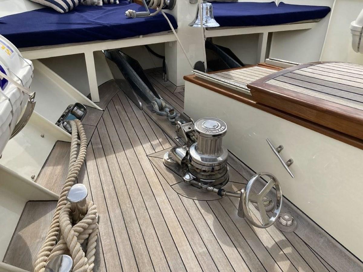 a metal object on a wooden surface aboard TIGERLILY OF CORNWALL Yacht for Sale