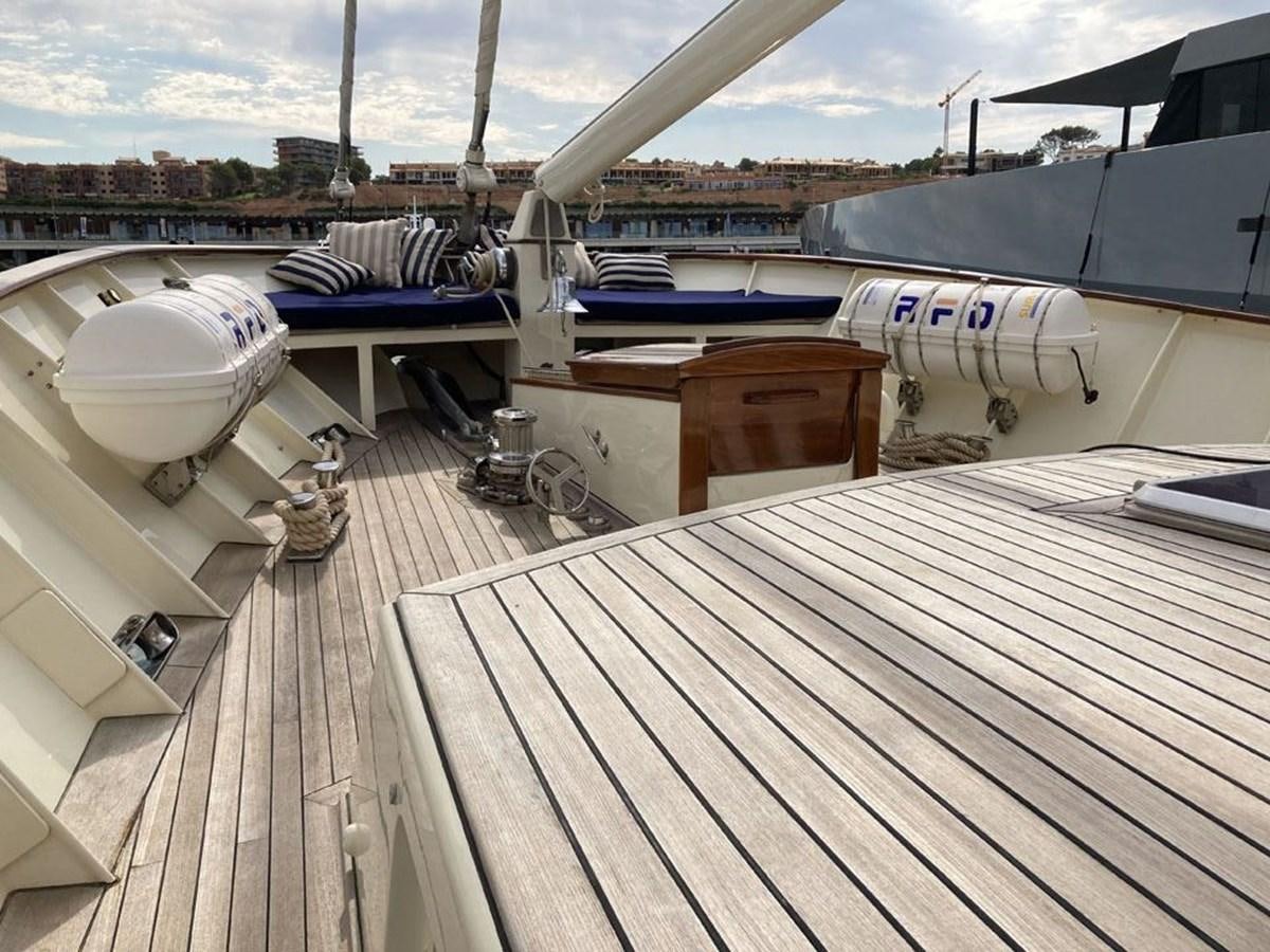 a deck with a deck and a large building with a large white building and a large building in aboard TIGERLILY OF CORNWALL Yacht for Sale