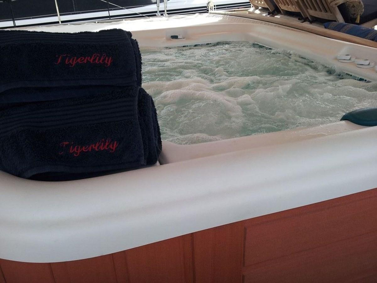 a blue hat on a boat aboard TIGERLILY OF CORNWALL Yacht for Sale