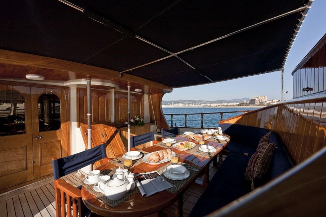 a table set for a meal on a boat aboard TIGERLILY OF CORNWALL Yacht for Sale