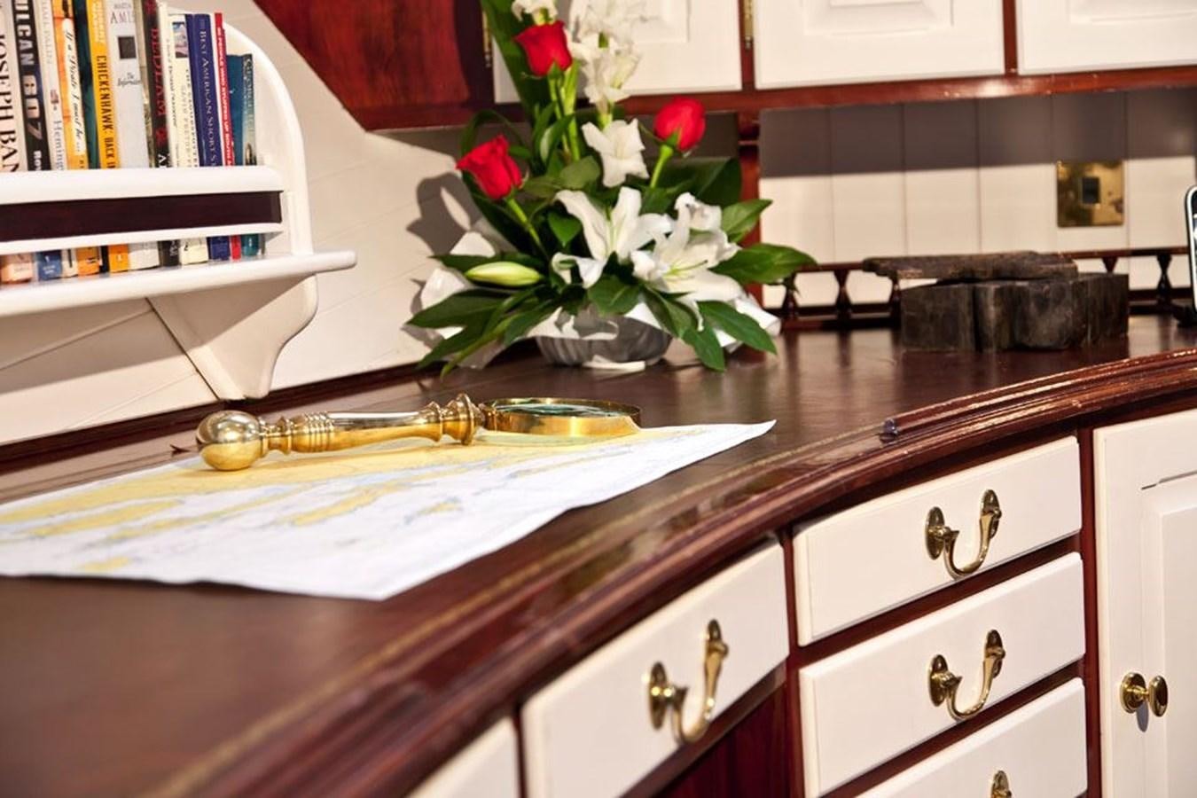 a kitchen counter with flowers aboard TIGERLILY OF CORNWALL Yacht for Sale