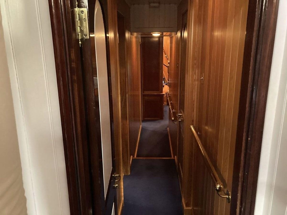 a hallway with wood doors aboard TIGERLILY OF CORNWALL Yacht for Sale
