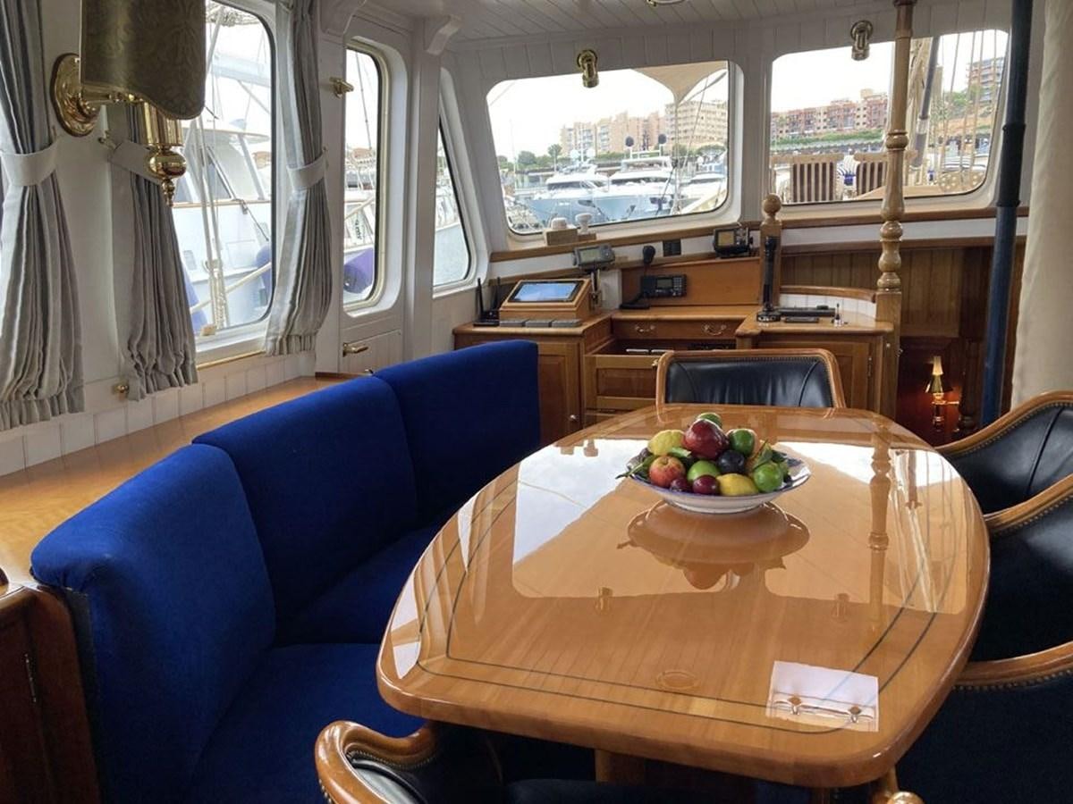 a bowl of fruit on a table aboard TIGERLILY OF CORNWALL Yacht for Sale