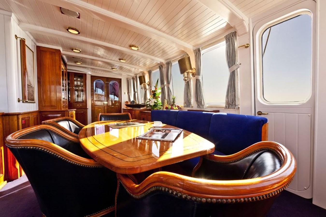 a train with a table and chairs aboard TIGERLILY OF CORNWALL Yacht for Sale