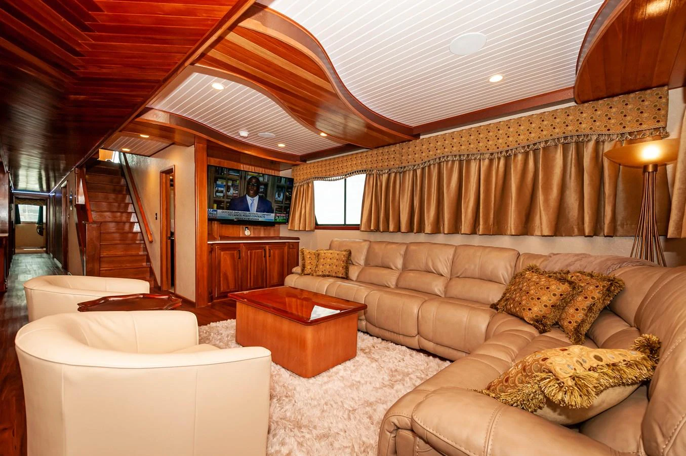 a living room with a large sofa aboard LE COLBY JEAN Yacht for Sale