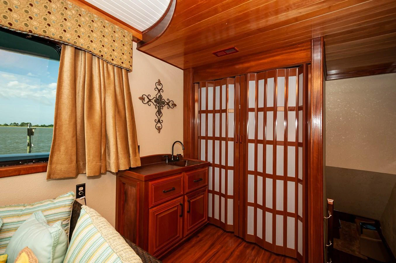 a room with a bed and a window aboard LE COLBY JEAN Yacht for Sale