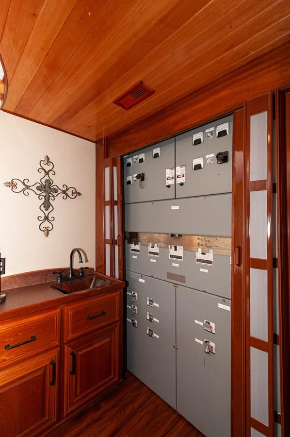 a kitchen with wooden cabinets aboard LE COLBY JEAN Yacht for Sale