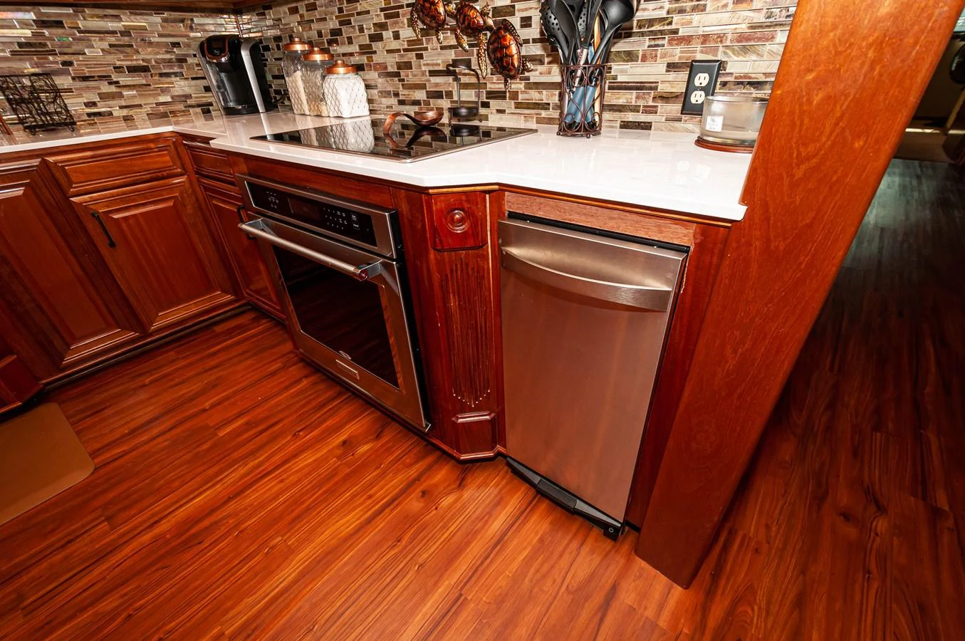 a kitchen with wooden cabinets aboard LE COLBY JEAN Yacht for Sale