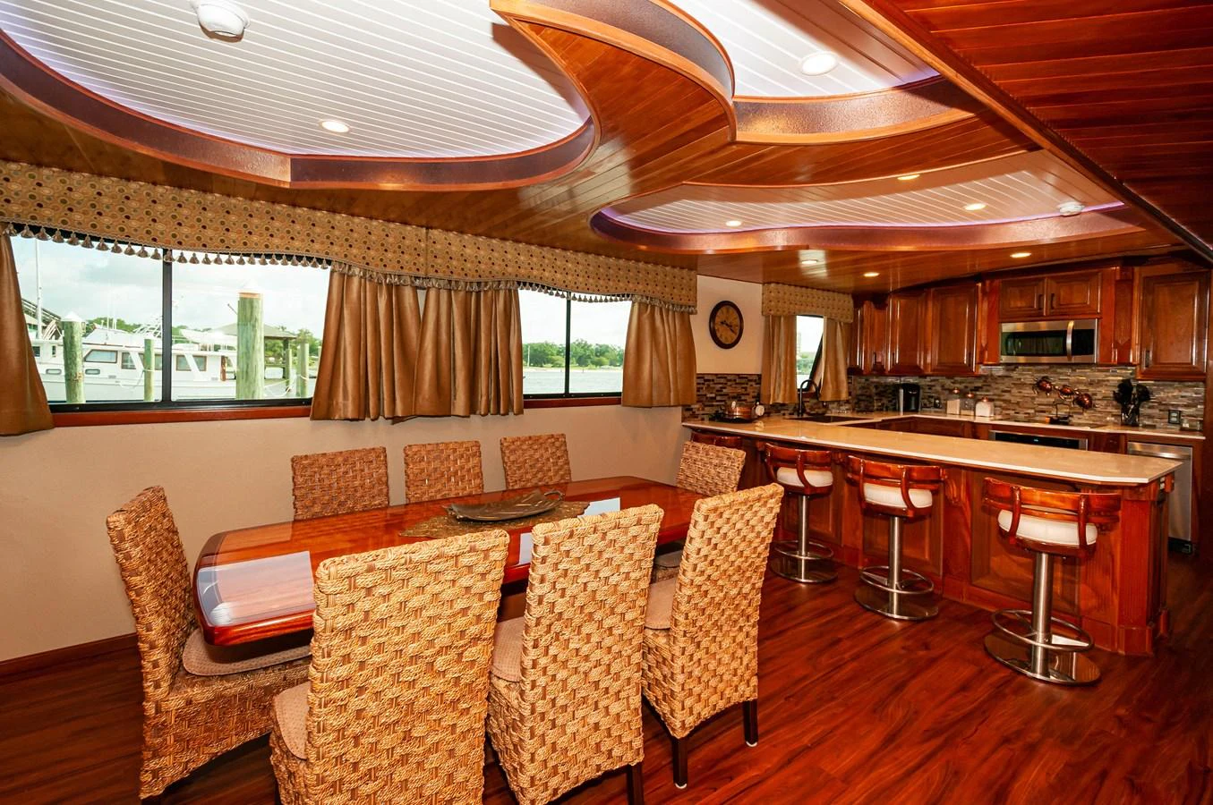 a large kitchen with a dining table aboard LE COLBY JEAN Yacht for Sale