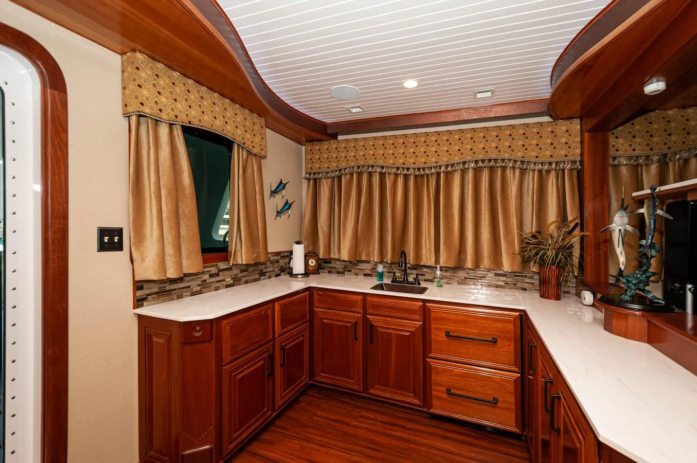 a bathroom with a sink and a mirror aboard LE COLBY JEAN Yacht for Sale